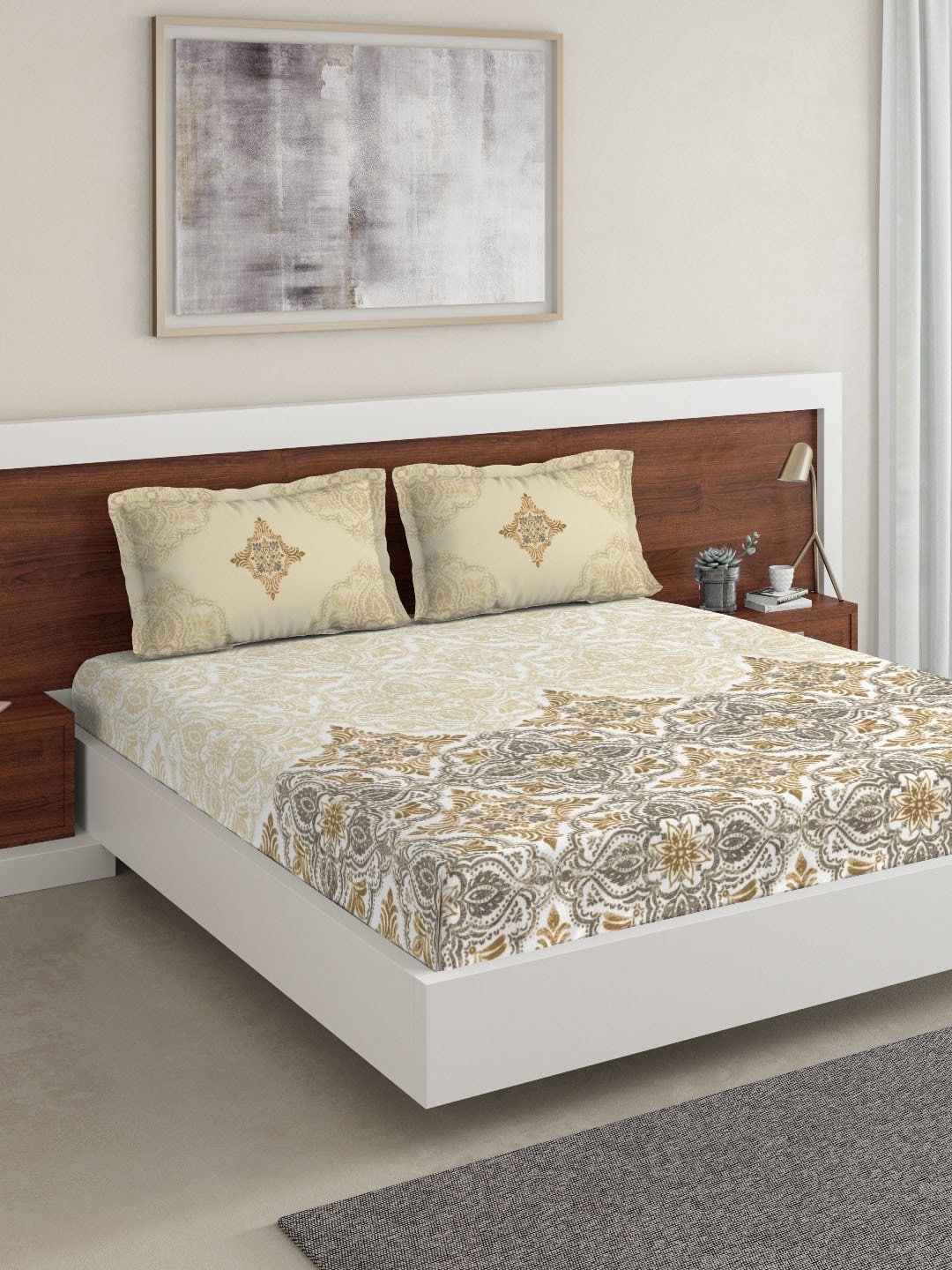 https://cdn.shopify.com/s/files/1/1857/6931/products/e1623e72-f674-4a6b-975c-49c3800ff90e1644433043634DDecorBeigeGreyEthnicMotifs180TCCotton1KingBedsheetwith2Pill1.jpg?v=1703244577