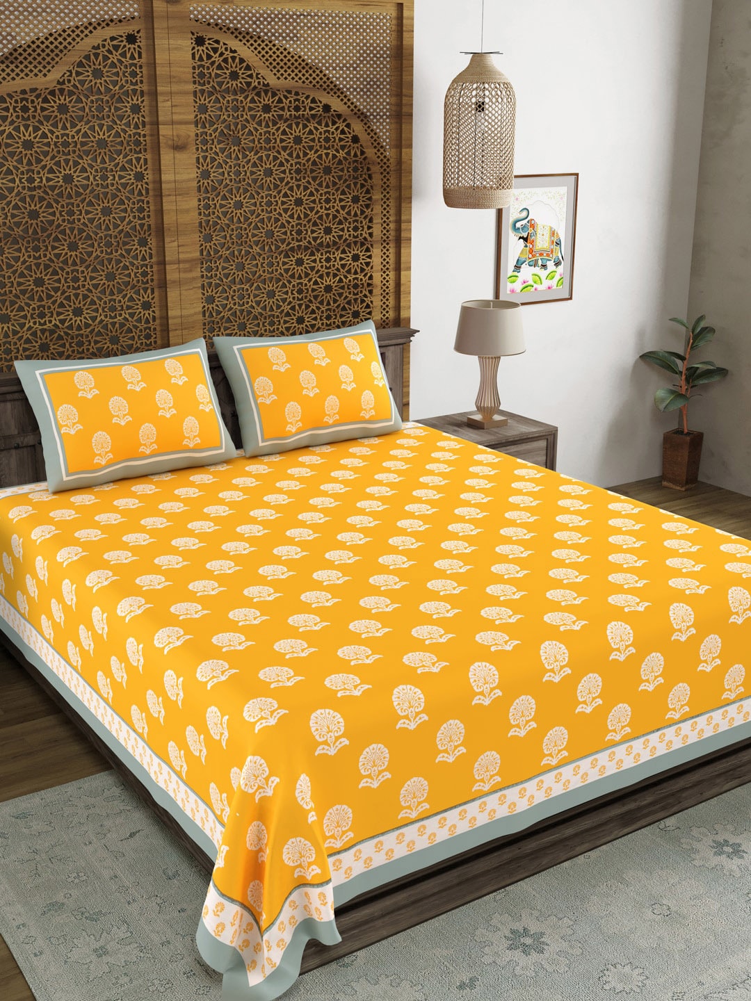 https://cdn.shopify.com/s/files/1/1857/6931/products/e6ab3b3d-a083-4b22-a326-71efb5c97c191697107424780BLOCKSOFINDIAYellowWhiteEthnicMotifs210TCKingBedsheetwith2Pi1.jpg?v=1762418659