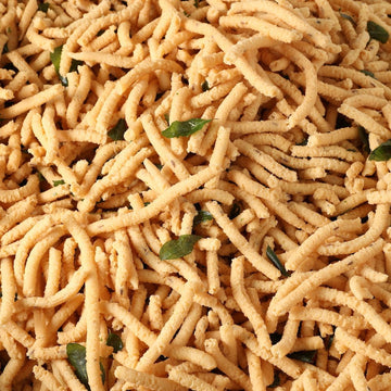 https://cdn.shopify.com/s/files/1/1857/6931/files/garlic-murukku-355582.jpg?v=1762168915