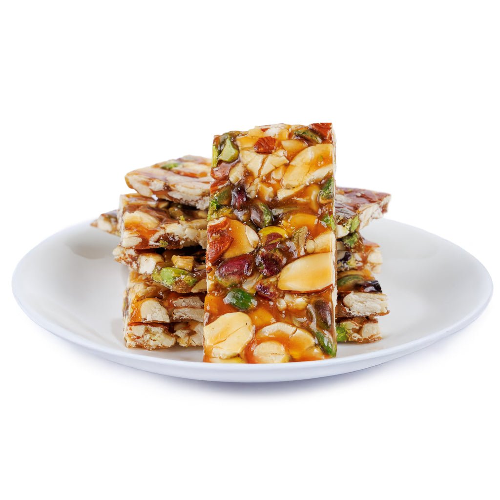 https://cdn.shopify.com/s/files/1/1857/6931/files/jaggery-dry-fruit-chikki-9954343.jpg?v=1762169540