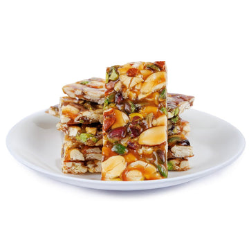 https://cdn.shopify.com/s/files/1/1857/6931/files/jaggery-dry-fruit-chikki-9954343.jpg?v=1762169540