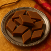 https://cdn.shopify.com/s/files/1/1857/6931/files/karupatti-kaju-katli-6738559.png?v=1762168715