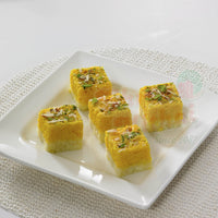 https://cdn.shopify.com/s/files/1/1857/6931/files/kesar-burfi-184279.jpg?v=1762168946