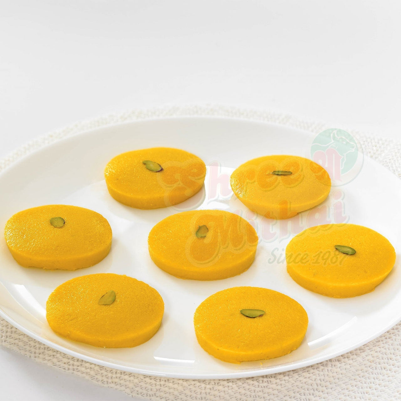 https://cdn.shopify.com/s/files/1/1857/6931/files/kesar-peda-119823.jpg?v=1762168953