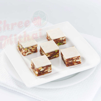 https://cdn.shopify.com/s/files/1/1857/6931/files/khajur-pak-658487.jpg?v=1762169356