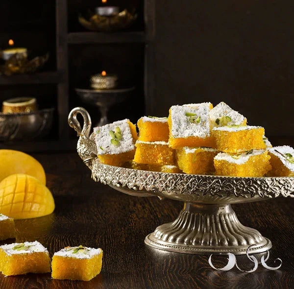 https://cdn.shopify.com/s/files/1/1857/6931/files/mango-coconut-barfi.webp?v=1763122683