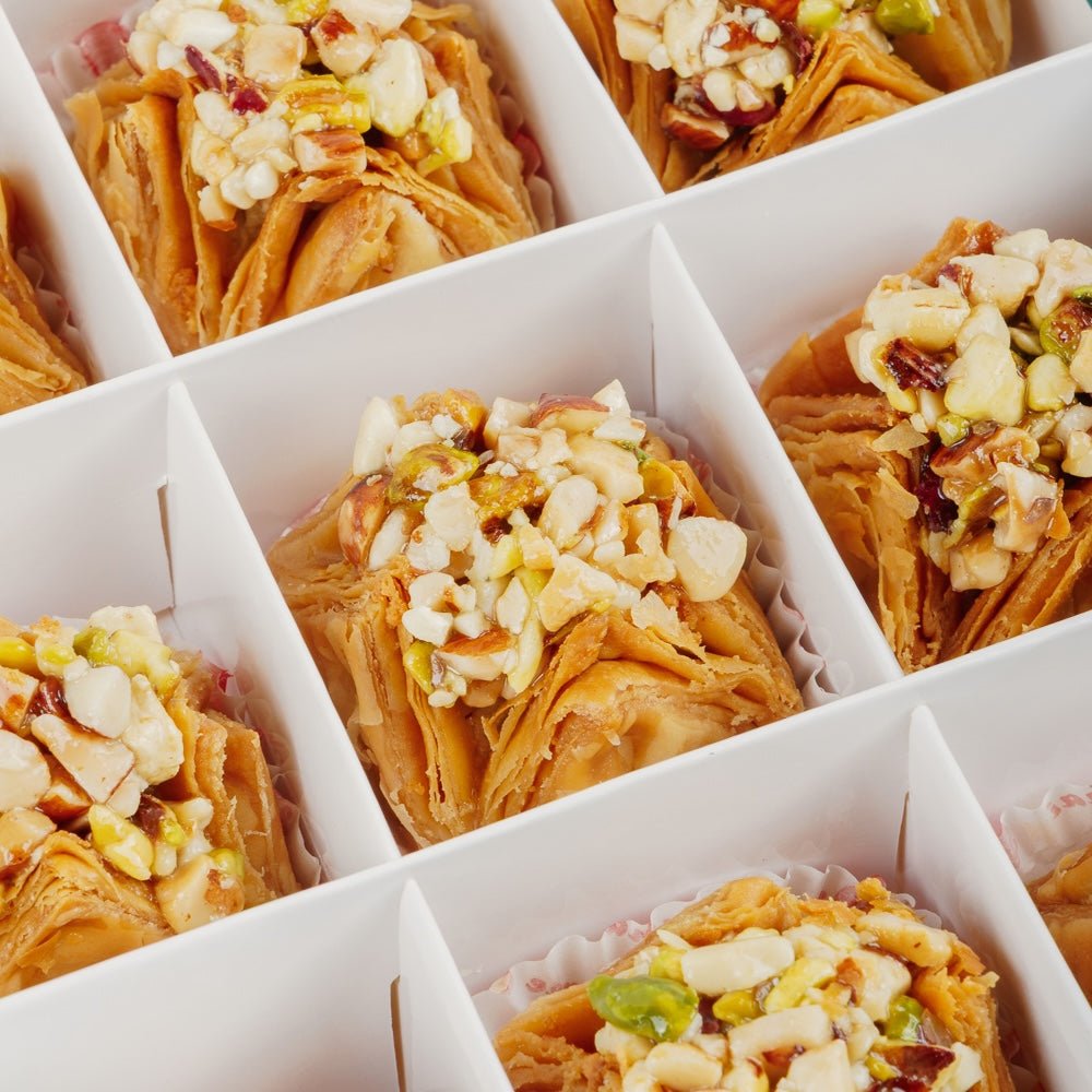 https://cdn.shopify.com/s/files/1/1857/6931/files/mixed-dry-fruit-pyramid-baklava-5339603.jpg?v=1762169190