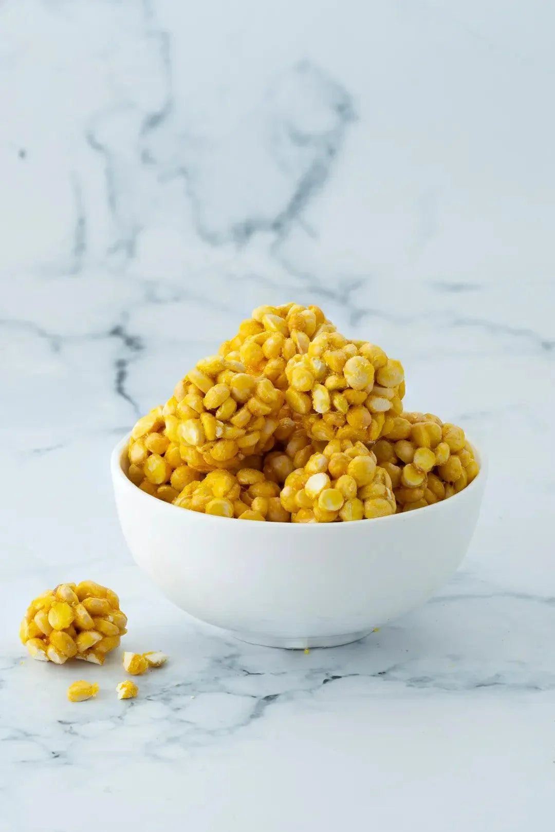 https://cdn.shopify.com/s/files/1/1857/6931/files/roasted-gram-chikki-ball.webp?v=1768912771