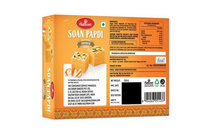 https://cdn.shopify.com/s/files/1/1857/6931/products/soan_papdi_oranf_500gm_back.jpg?v=1671714988