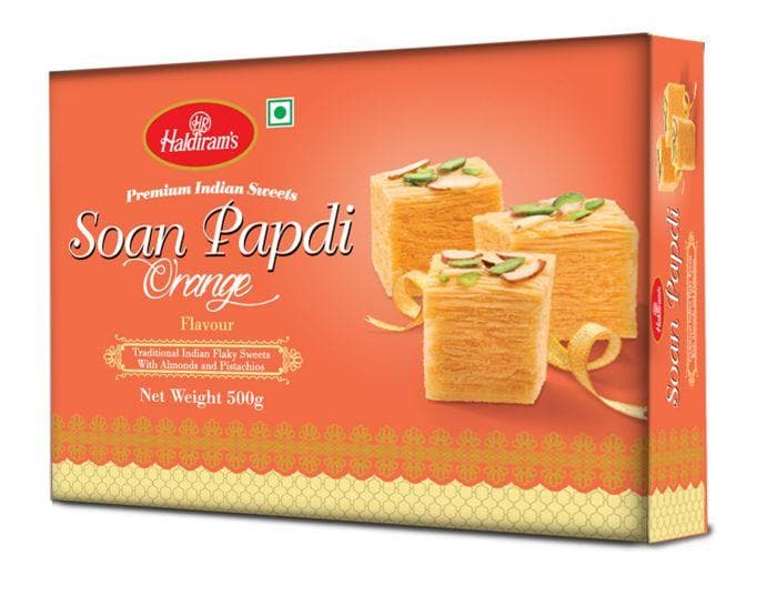 https://cdn.shopify.com/s/files/1/1857/6931/products/soan_papdi_orange_500g.jpg?v=1671714988