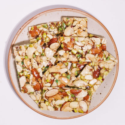 https://cdn.shopify.com/s/files/1/1857/6931/files/sugarfree-dry-fruit-chikki-9102589.jpg?v=1762169497