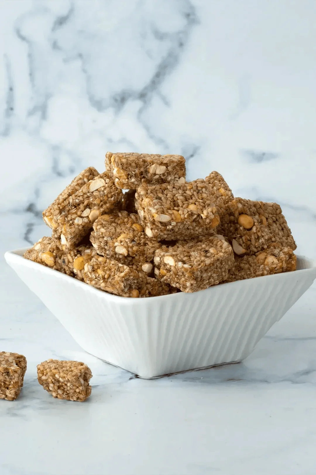 https://cdn.shopify.com/s/files/1/1857/6931/files/white-sesame-chikki-bar.webp?v=1768913039